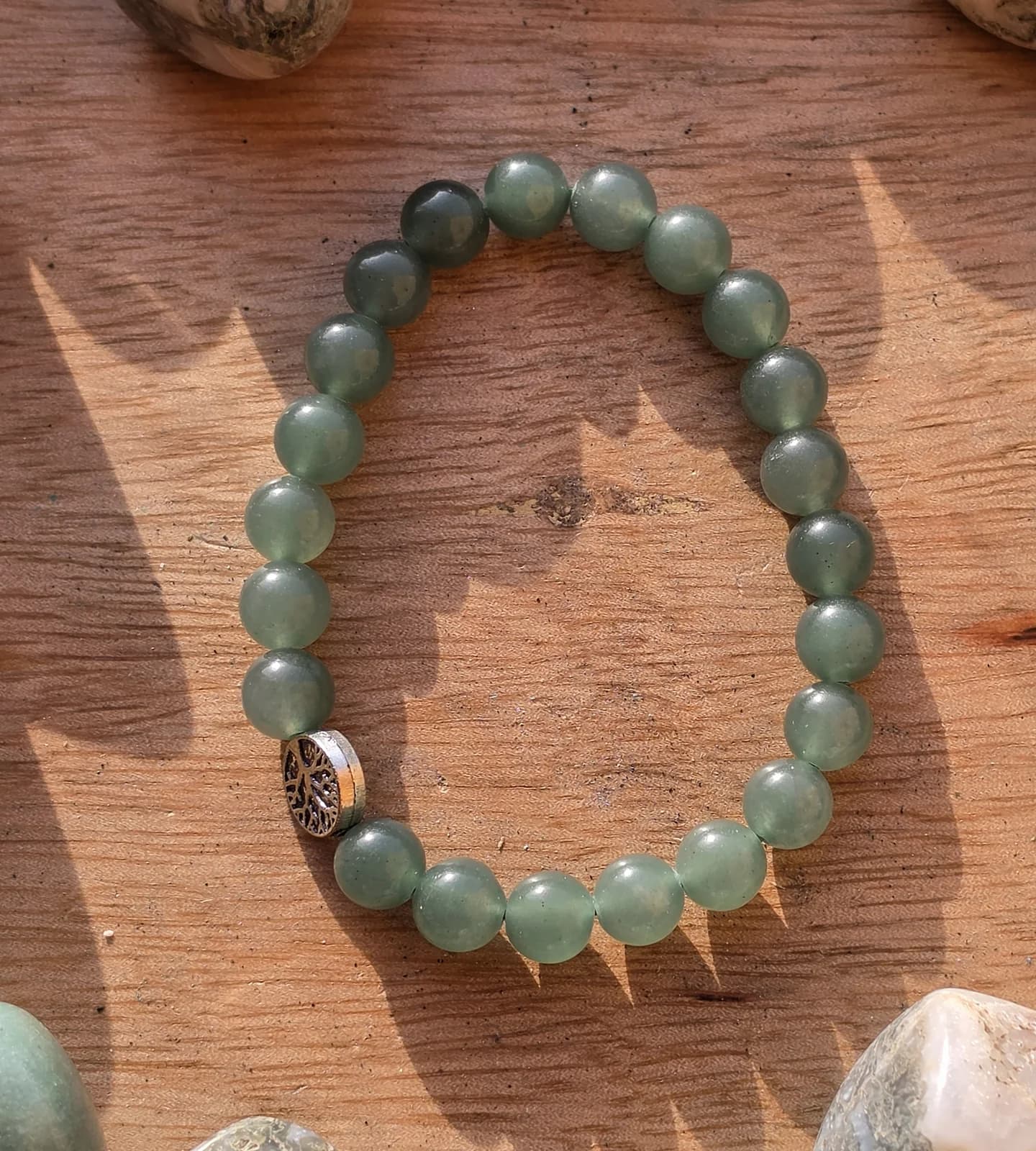 A green aventurine bracelet in the Sacred Divine studio
